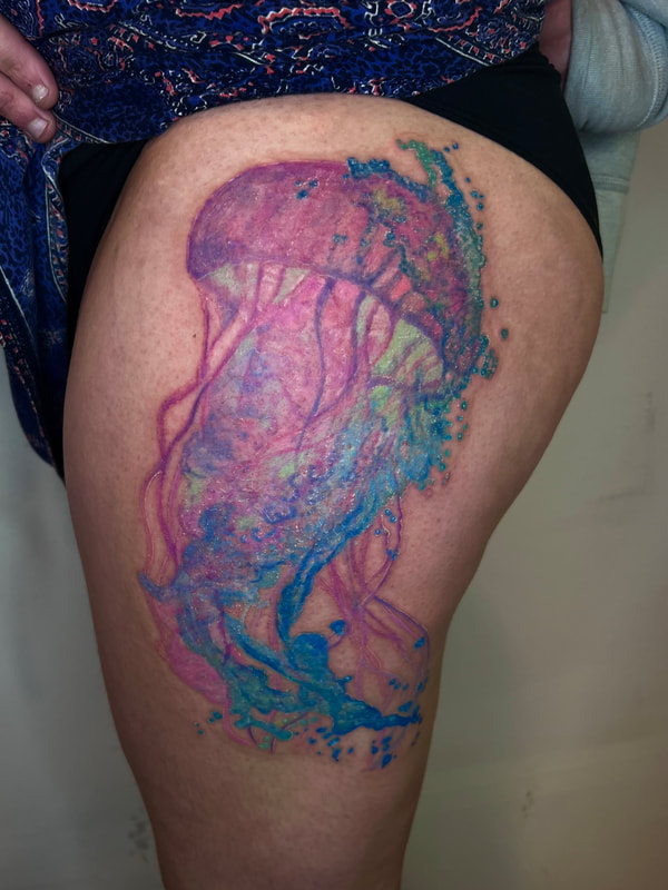 Pink and purple pastel jellyfish with blue watercolor splash.