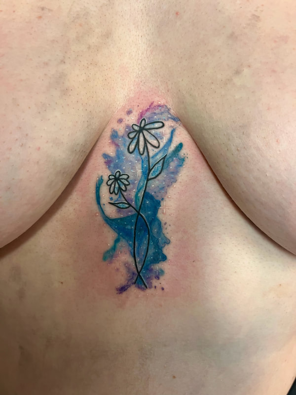 Blue watercolor flowers on a sternum.